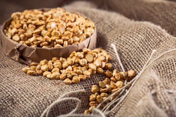 Split Roasted Chickpeas on Burlap Fabric – Rustic Healthy Snack