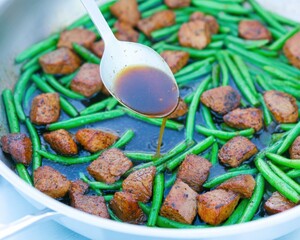 Pork and green beans in a pan