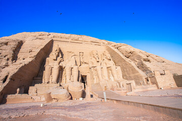 The site features four 20-meter statues of Ramses II carved into rock. Murals inside depict the Pharaoh's victories, highlighting ancient Egypt's grandeur. Abu Simbel Temples, Aswan, Egypt.