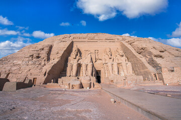 Close up of the majestic Great Temple of Ramses II at Abu Simbel, Aswan, Egypt. The colossal seated statues of Pharaoh Ramses II dominate this iconic ancient Egyptian monument.