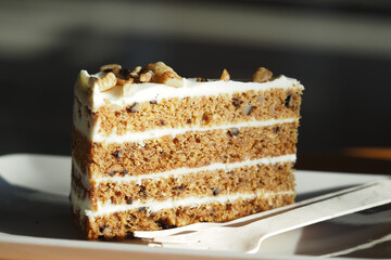 Delicious slice of carrot cake with cream cheese frosting