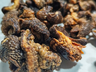 Snail chips are a typical Indonesian snack that is famous for being delicious, savory and crunchy.