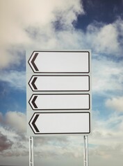 Blank sign post against cloudy sky