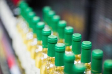 Wine bottle arranged on shelf