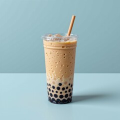 Refreshing tropical bubble tea with tapioca pearls and ice in a clear plastic cup with a straw, minimalistic background for summer refreshment beverage