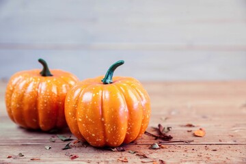 Two pumpkins on table during Thanksgiving time