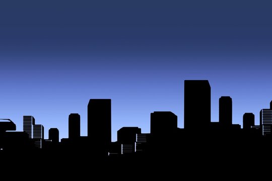 Silhouette cityscape against clear blue sky