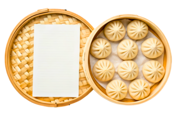 Steamed dumplings in a bamboo basket with blank paper isolated with transparent background