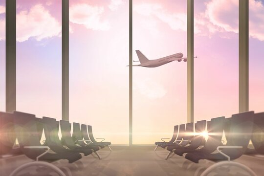 Fototapeta Airplane flying past departures lounge window