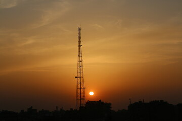 Obraz premium Sunset Silhouette of a Communication Tower