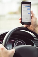 Man driver using smart phone in car, Write message
