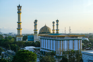 Evening light casts a golden hue over the Islamic Center Mosque in Mataram city, Lombok, with...