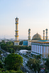 Evening light casts a golden hue over the Islamic Center Mosque in Mataram city, Lombok, with...