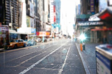 Flat design city street showing marked asphalt road with yellow cabs and bright streetlight flare