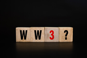 world war 3 with question mark on wooden blocks isolated on dark background