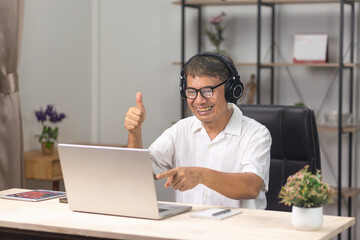 Seniors  man is learning to upskill  AI technology.