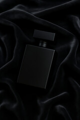 Black Perfume Bottle on Velvet Cloth