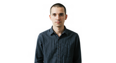 A serious young man stands directly looking at the viewer against transparency with even lighting.