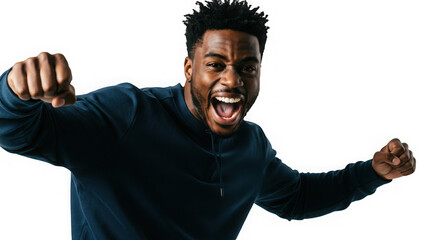 Energetic young man with a bright smile celebrates success and joy with raised fists triumphantly.