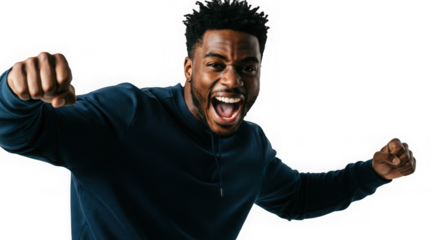 Energetic young man with a bright smile celebrates success and joy with raised fists triumphantly.