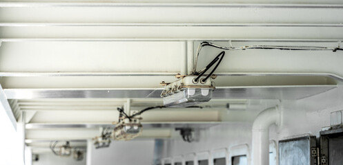 Modern Industrial Ceiling Design Featuring Unique Lighting and Cabling Elements