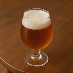 glass of beer on wooden table