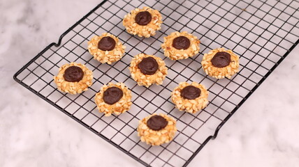 Cheese Peanut Chocolate in the photo on a marble table and small wooden bowl and mesh pan