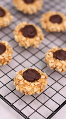 Cheese Peanut Chocolate in the photo on a marble table and small wooden bowl and mesh pan