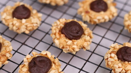 Cheese Peanut Chocolate in the photo on a marble table and small wooden bowl and mesh pan