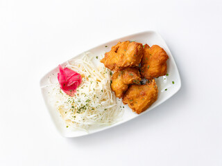 Fried chicken and cabbage salad on a plate