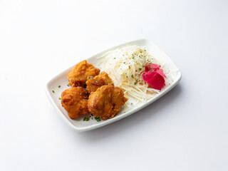 Fried chicken and cabbage salad on a plate