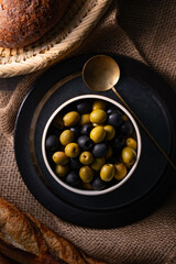 Green and Black Olives.This close-up features vibrant green and rich black olives, perfect for...