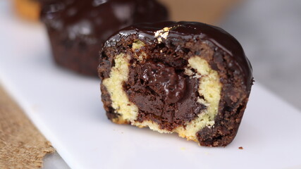 three cakes with frosted and gold chocolate topping and crunchy chocolate filling