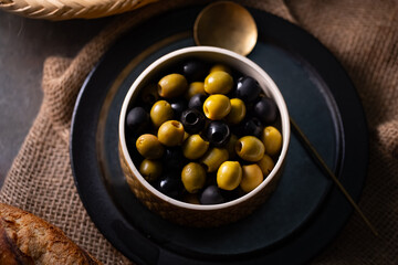 Green and Black Olives.This close-up features vibrant green and rich black olives, perfect for...