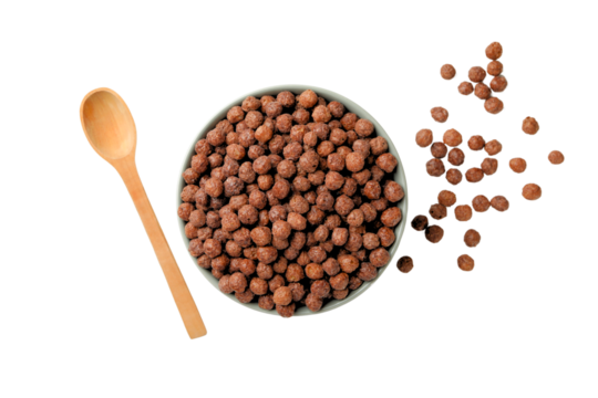 Chocolate cereal in bowl with spoon nearby, isolated on white, PNG