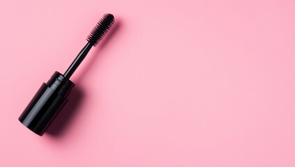 Black mascara wand on pink background (2)