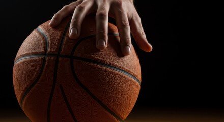 Both hands gripping a basketball from opposing sides tightly, as in a jump ball or defensive stance, nails slightly pressing the ball surface texture
