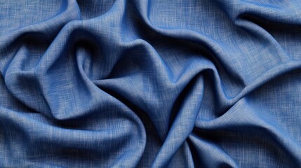 Fototapeta premium Close-up of soft blue denim fabric with natural folds and textured weave for fashion and textile design