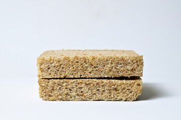 Side view of two whole wheat slices breads with abstract product background. Isolated on white. Clipping path. pile, stack. close up.