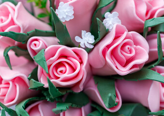 A bouquet of pink roses with green stems