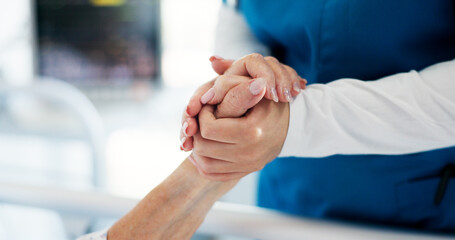 Holding hands, caregiver and ill patient on bed in hospital for healthcare service, support and trust. Chronic disease, nurse or person with sickness at clinic for help, empathy or comfort in ward