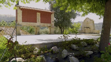 The communal corn crib and public water supply of a mountain village in Portugal. - Powered by Adobe