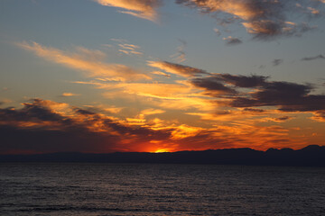 A scenic view of a sunrise or sunset, with warm tones painting the sky. Perfect for use as...