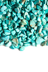Rough cut polished turquoise stones rocks isolated background backdrop. Hobbies and crafts supplies concept.