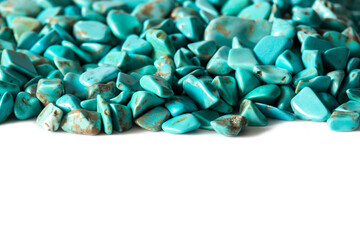 Rough cut polished turquoise stones rocks isolated background backdrop. Hobbies and crafts supplies concept.