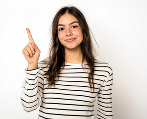 Smiling Woman in Striped Shirt Pointing Up – Studio Portrait with White Background, Perfect for Advertising, Branding, or Marketing Campaigns