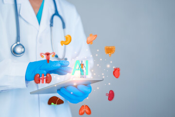 Doctors wearing blue gloves use tablets that display graphical images of human organs combined with...
