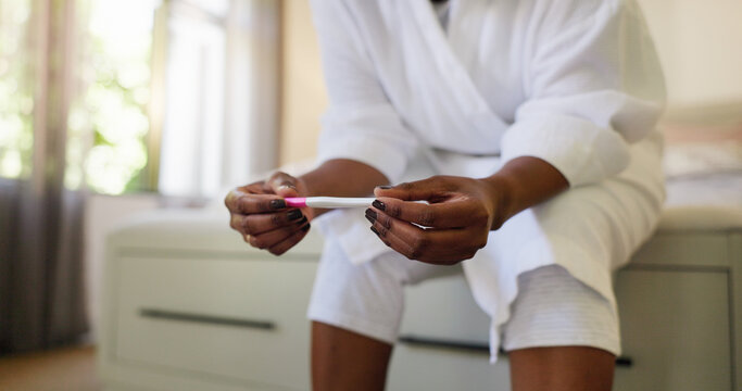 Reading, results and hands with pregnancy test, bedroom or expectant mother with confirmation stick. Fertility, check and black person with home exam kit, hCG hormone and tool for outcome of IVF
