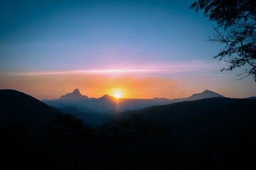 Gradien Sunsett Sky and Mountain Silhouettes in Itaipava, Brazil