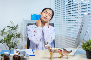 A confident Asian female veterinarian at her animal clinic feels stressed and overwhelmed by office...